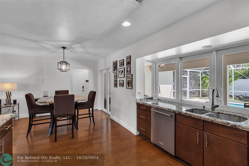 The high-top table has granite that matches the countertops and it will stay.