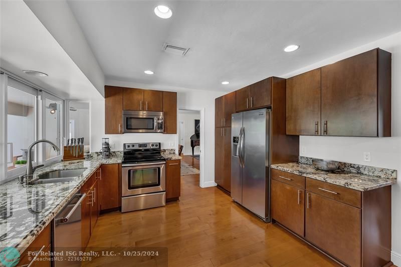 With lots of slide out drawers in these cabinets, there's a place for everything in this spacious kitchen.