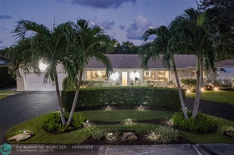 With the beautifully lit entry and the well placed landscape lighting, this home is quite welcoming, day or night!