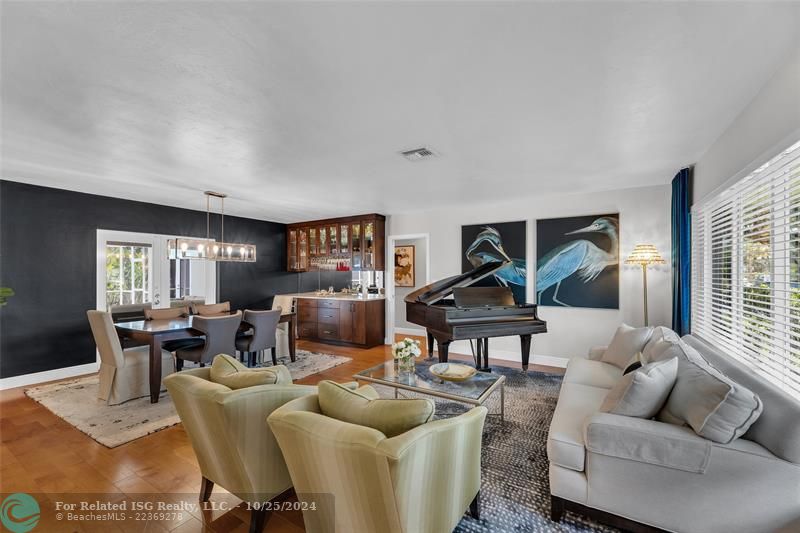 Walking into this elegant home to the right, you are greeted by this combined formal living and dining room which is spacious and flooded with light.