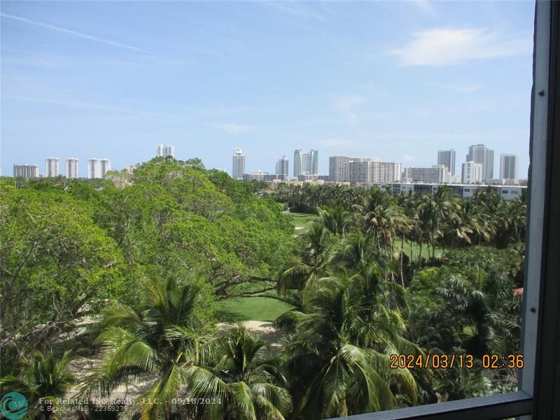 Screened terrace faces east to the beach