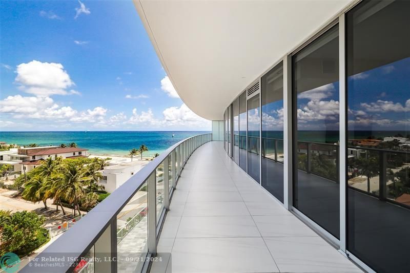 Oversized Balcony with picturesque views of the ocean and surrounding areas