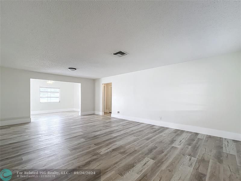 LIVING/DINING ROOM AREA LEADING TO FAMILY ROOM