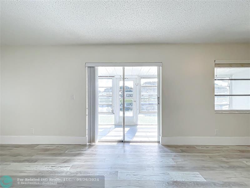 DIRECT FAMILY ROOM ACCESS TO REAR PATIO---WATER VIEW