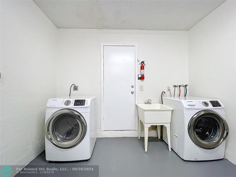 GARAGE WITH FULL SIZE WASHER/DRYER & SLOP SINK-ENTRY TO KITCHEN