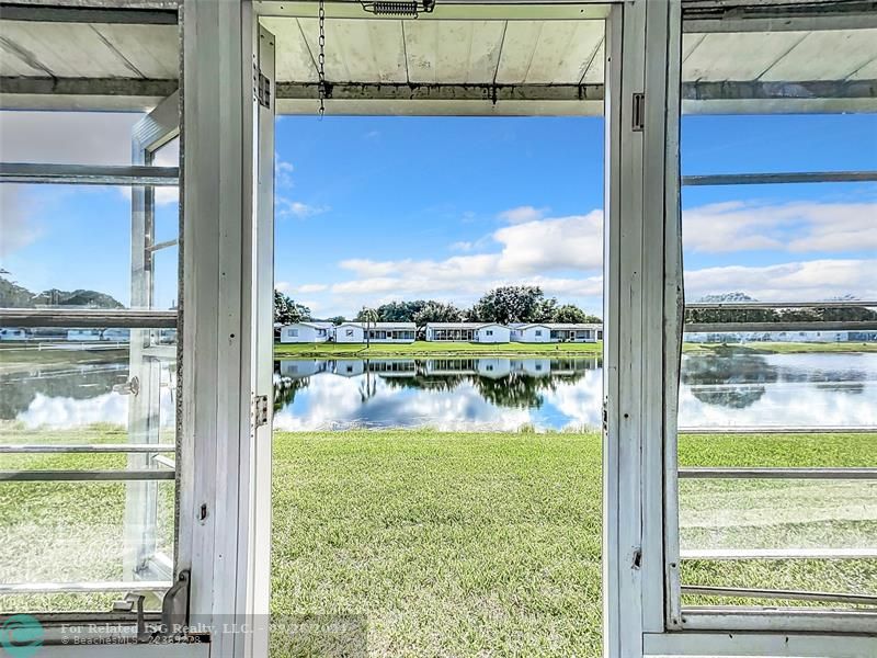 ENCLOSED PATIO ENTRY TO YARD ON WATER