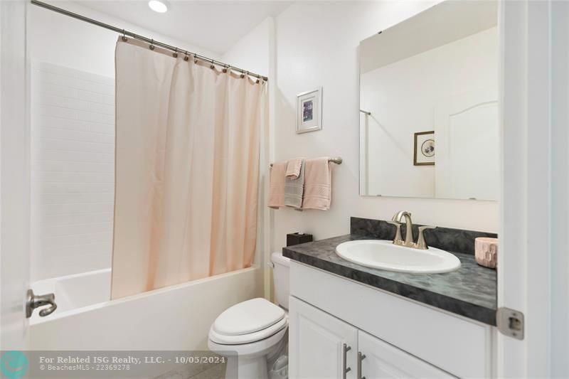 Guest bathroom with tub