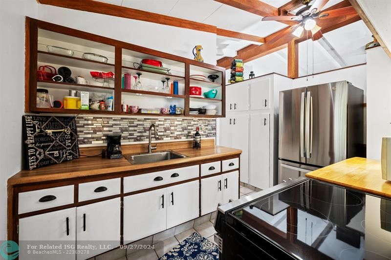 Kitchen with new refrigerator.