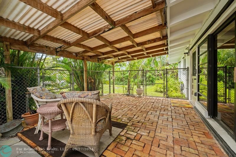 Covered brick patio.