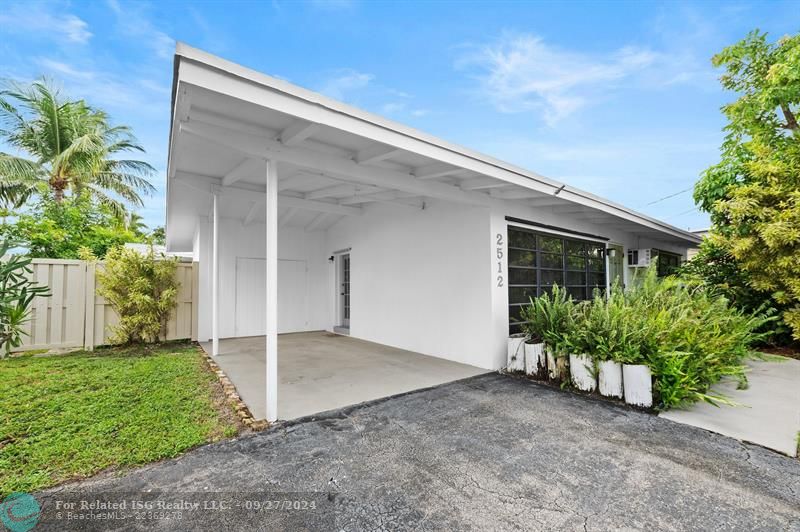 Covered parking with driveway.