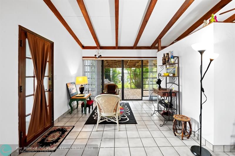 Sliding doors out to a covered brick patio.