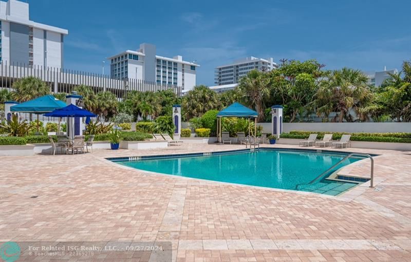 Resort style pool to enjoy laying out, swimming or BBQ after a beach day.