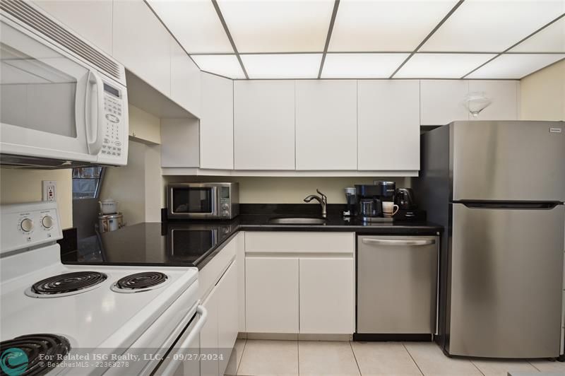 Bright, open kitchen with ample storage and counter space.