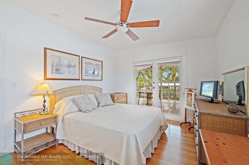 2nd bedroom with Double Doors out to the screened balcony patio.