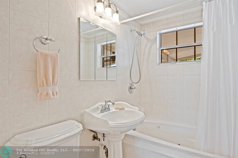 Guest Bathroom with jetted bathtub.