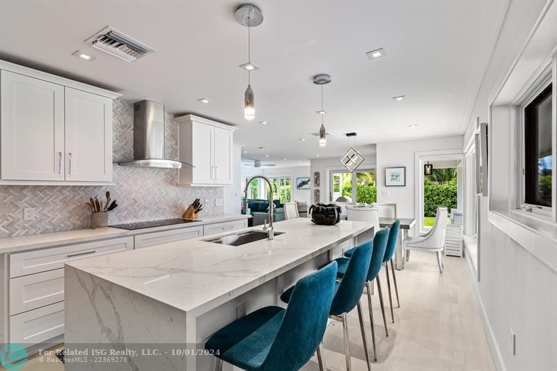 Island in kitchen with seating.