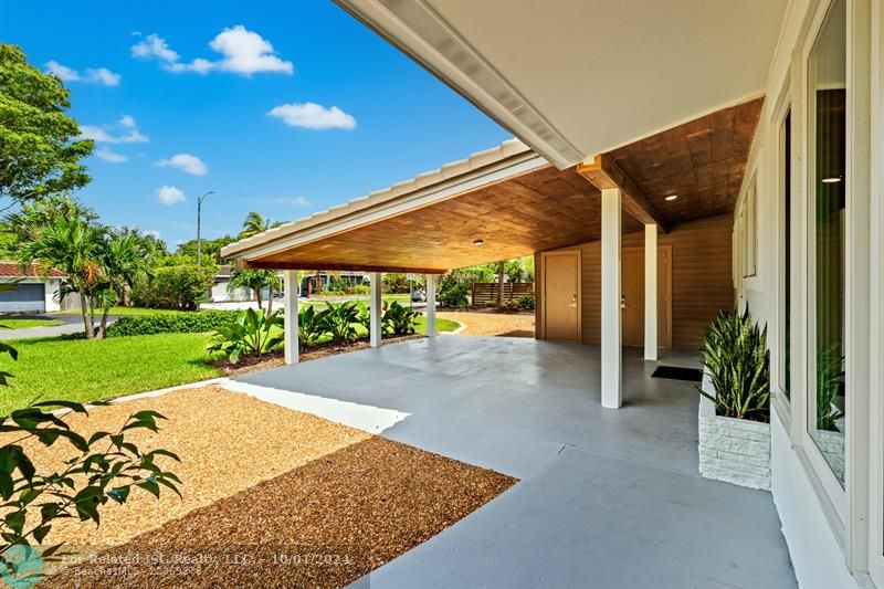 Carport with storage room.