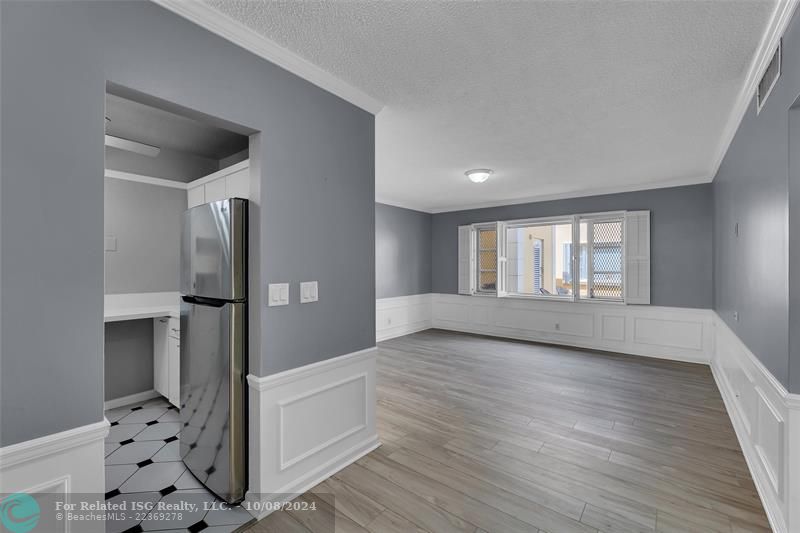 Dining room with view into living room and kitchen