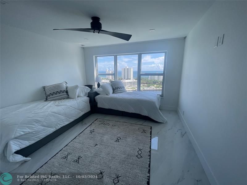 Guest Bedroom with an ocean view