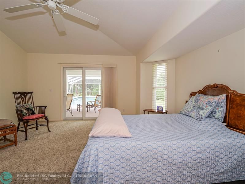 Master suite opens to pool area.