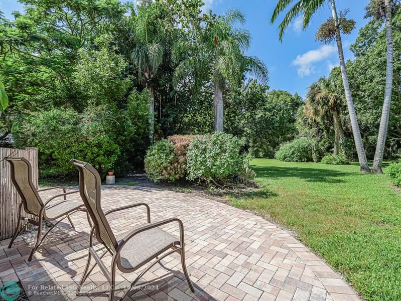 Stroll the brick sidewalk and enjoy the tropical landscaping!