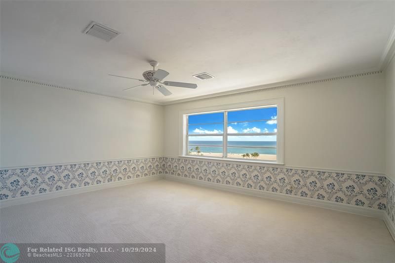 Spacious master bedroom with ocean views