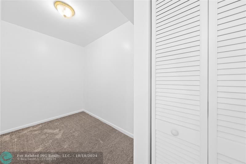 Huge walk in closet in primary bedroom