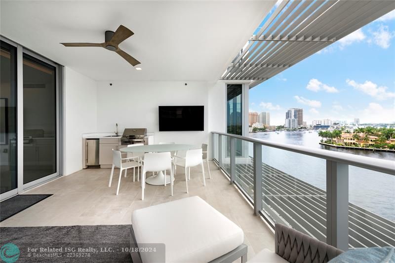 balcony with summer kitchen and TV