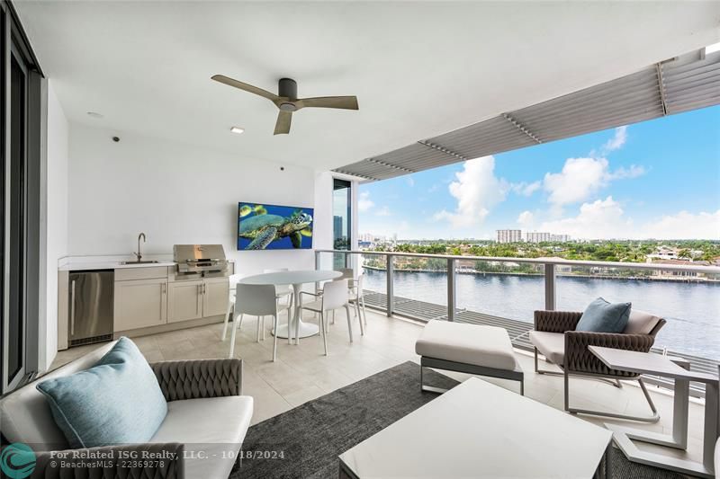 balcony with summer kitchen and TV