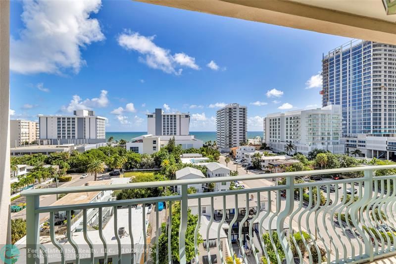 Primary bedroom suite has direct ocean views from a covered balcony.