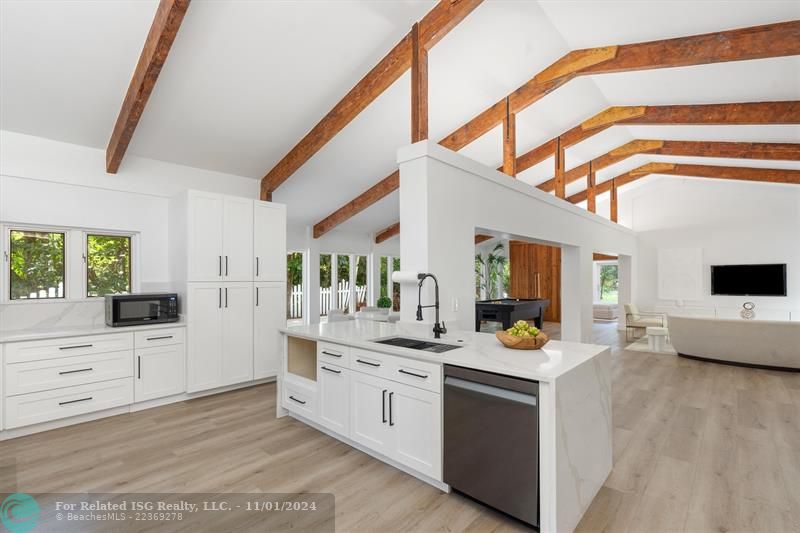 new kitchen with solid wood cabinets. quartz waterfall.