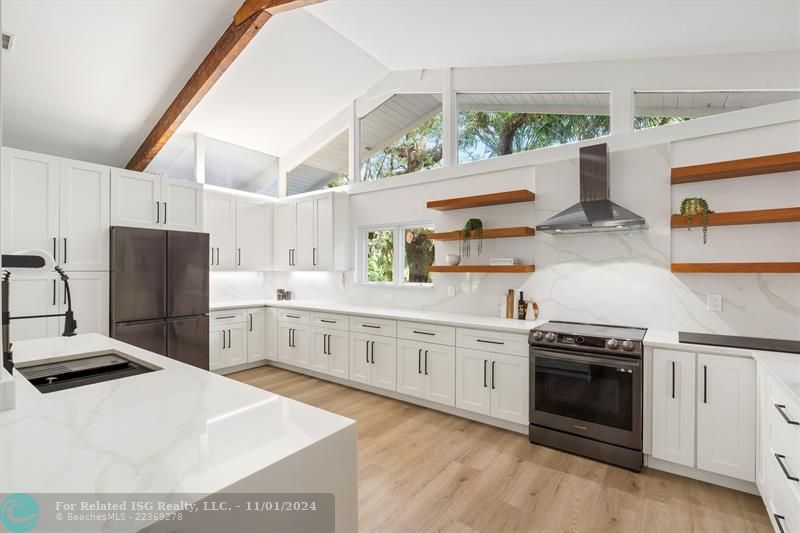 new kitchen with solid wood cabinets. quartz waterfall.