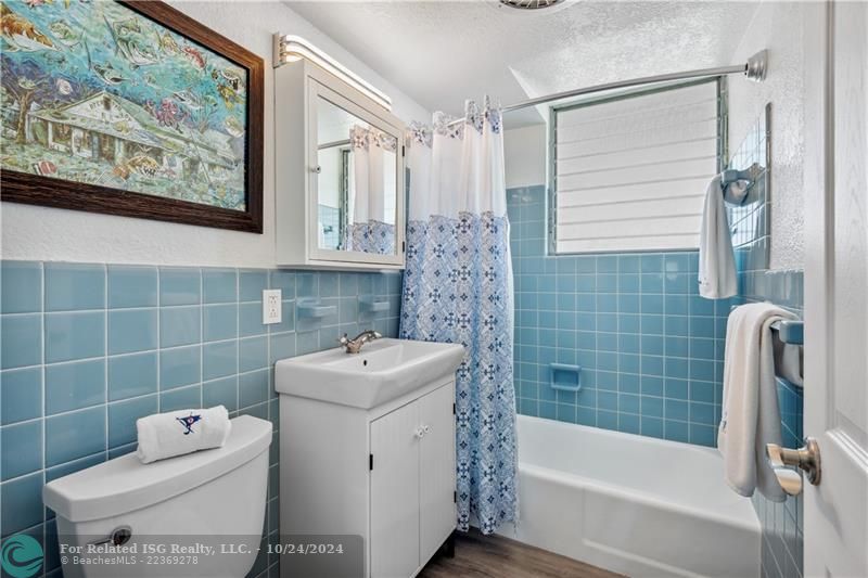 Beautiful wood floors extending into your bathroom.