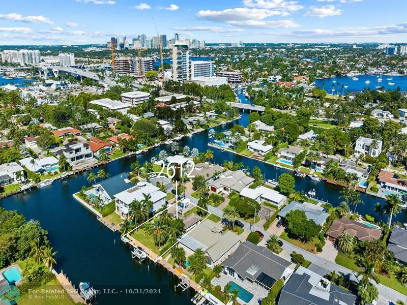 Aerial View Of Home With Box & City Skyline