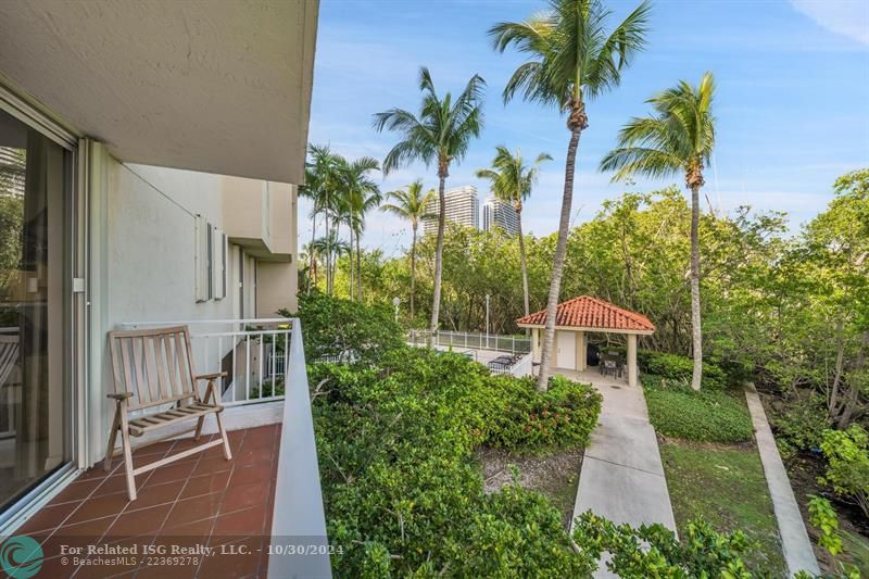 Side balcony views of the preserve and pool area.