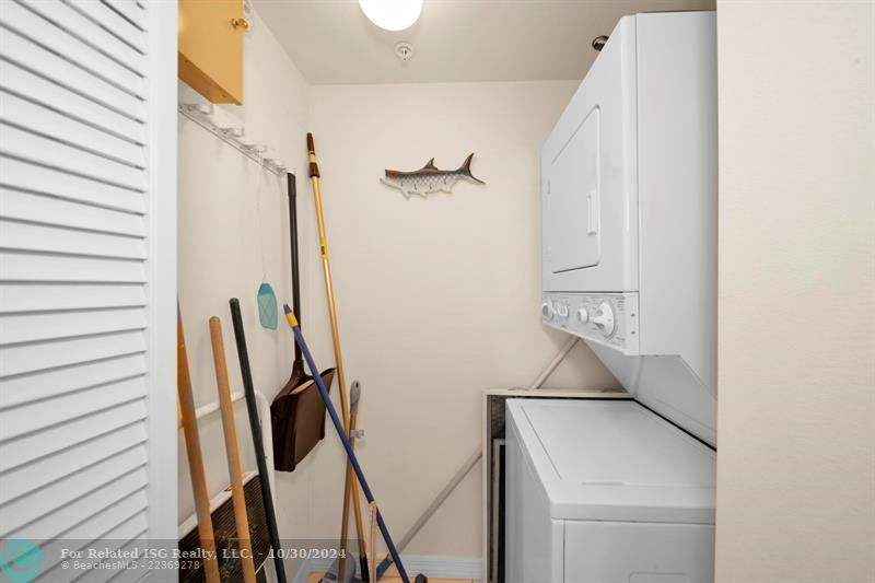 Washer/Dryer in unit with closet.