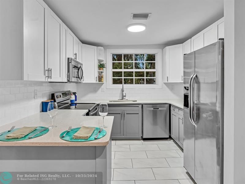 UPDATED KITCHEN WITH STAINLESS STEEL APPLIANCES