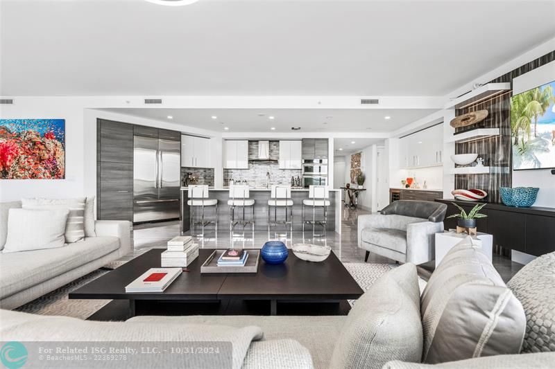 Open & expansive living area with model high-end furnishings & decor