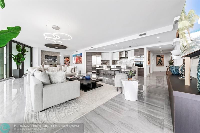 Open & expansive living area with model high-end furnishings & decor