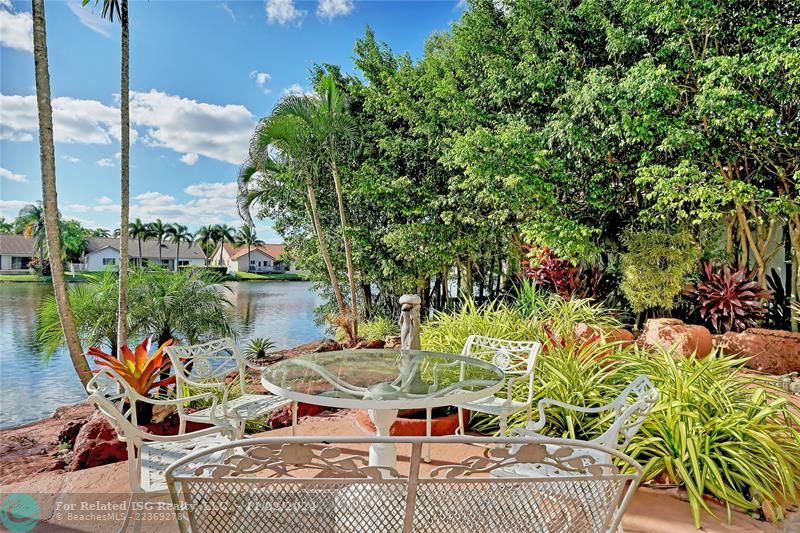 Backyard with exotic landscape,cusom made rocks and water fall opens to beautiful lake front