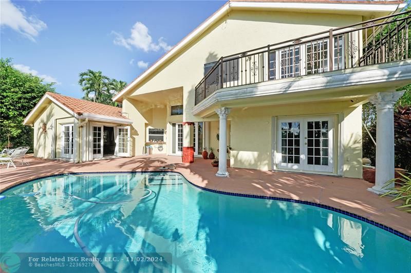 Backyard with exotic landscape,cusom made rocks and water fall opens to beautiful lake front