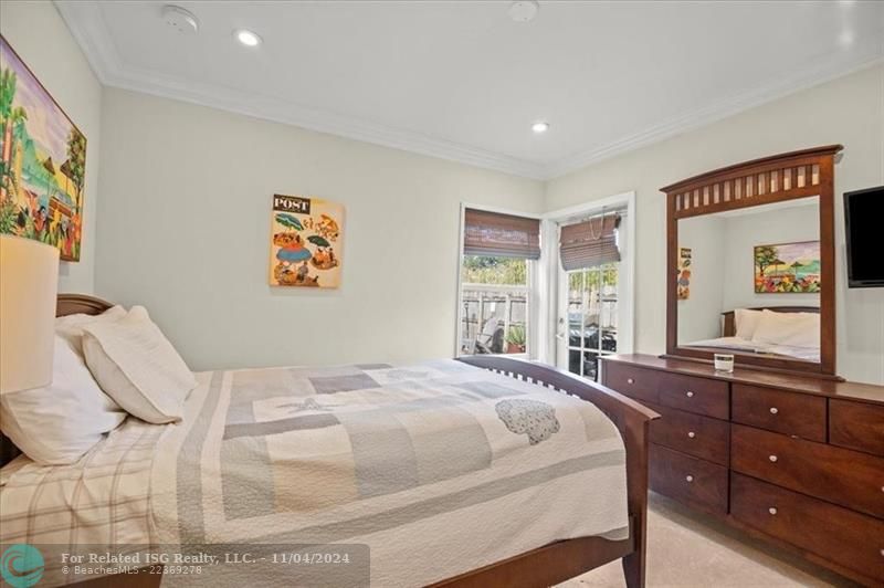 Bedroom #3 with French door to the backyard area.