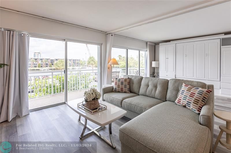 Living Room can be sectioned off for privacy with a convenient hidden pull-down Murphy bed.