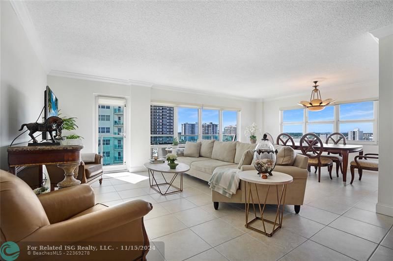 This corner apartment is bright and sunny. The door leads out to the balcony.