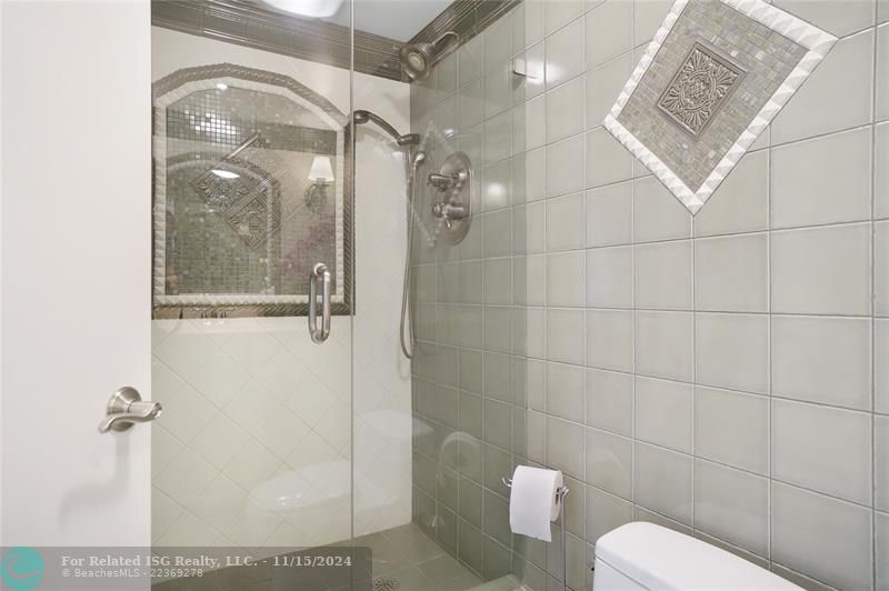 The second bathroom features a shower.