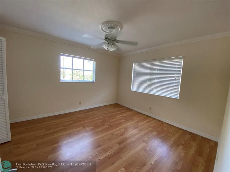 Living room with French doors opened to the balcony.