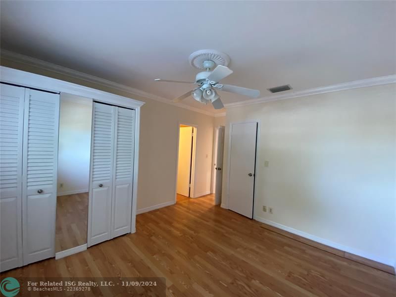 Living room with French doors opened to the balcony.