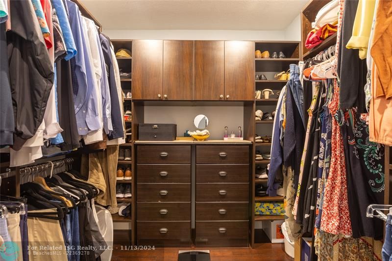 Master walk in closet with cabinetry