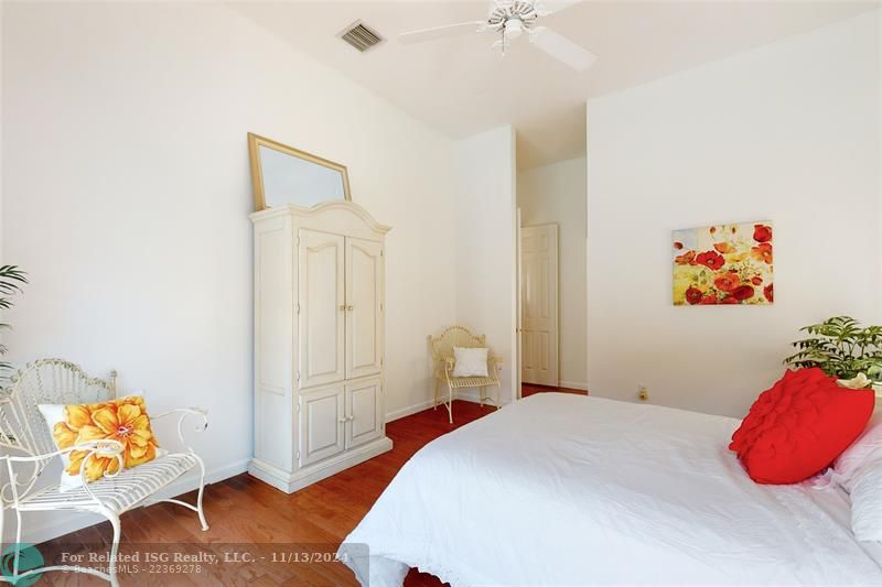 Primary bedroom room with pool views