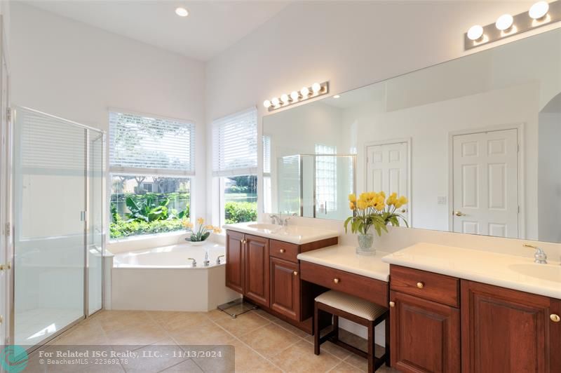 Primary bath with walk in closets and LAKE view